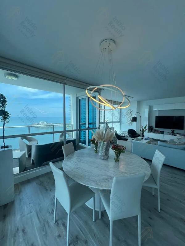 Dining and living room with balcony and ocean views in PH Oceanaire Punta Pacifica Panama
