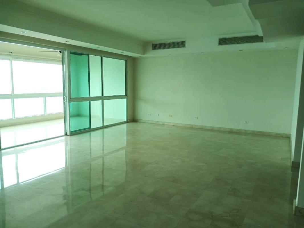 Luxury living room with marble flooring, large panoramic windows, recessed lighting in Vista Marina at Avenida Balboa