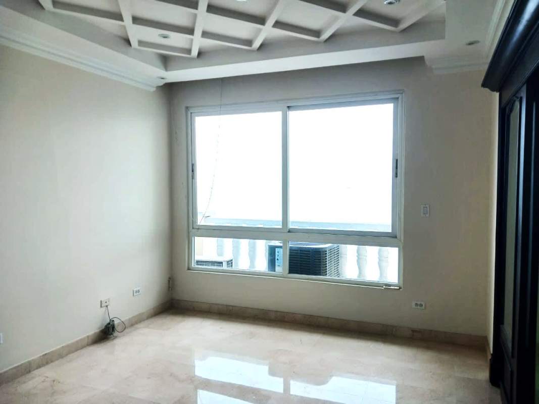 Empty modern room with marble floors large window and ocean skyline view at PH Vista Marina Panama City