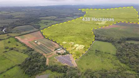 Large solar farm surrounded by cultivated fields at agricultural estate in Panama