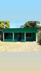 Simple interior kitchen with teal painted walls concrete countertop in David Chiriquí Panama