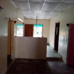 Simple spacious living area with arched doorway tiled floor David Chiriquí