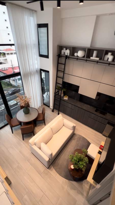 Loft-style living dining with floor-to-ceiling windows double-height ceiling PH Arcadia Coco del Mar