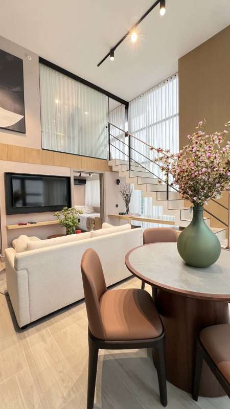 Double height modern living dining area mezzanine style apartment PH Arcadia Coco del Mar Panama City