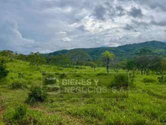 Panoramic aerial of agricultural land near Boquete Panama bordered by river with mountains around
