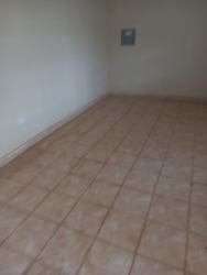 Covered walkway and front of retail spaces at Costa Verde commercial plaza Panama