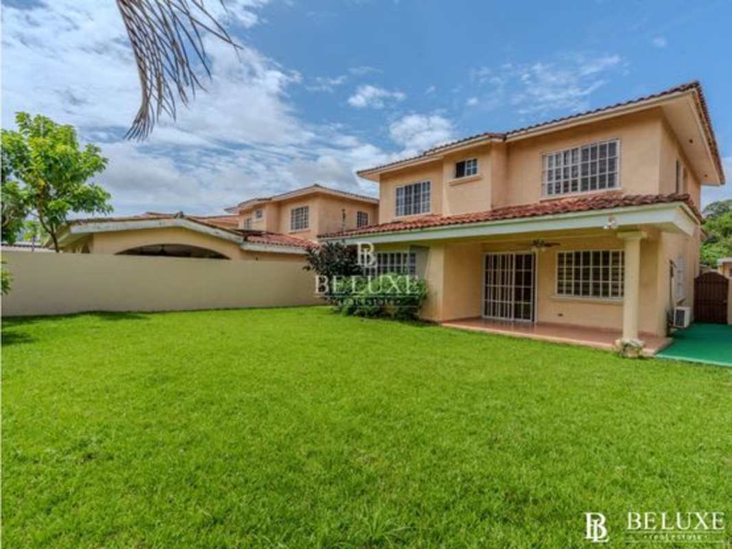 Spacious kitchen with granite countertops, wood cabinets, window, stove in Albrook Gardens Clayton Panama