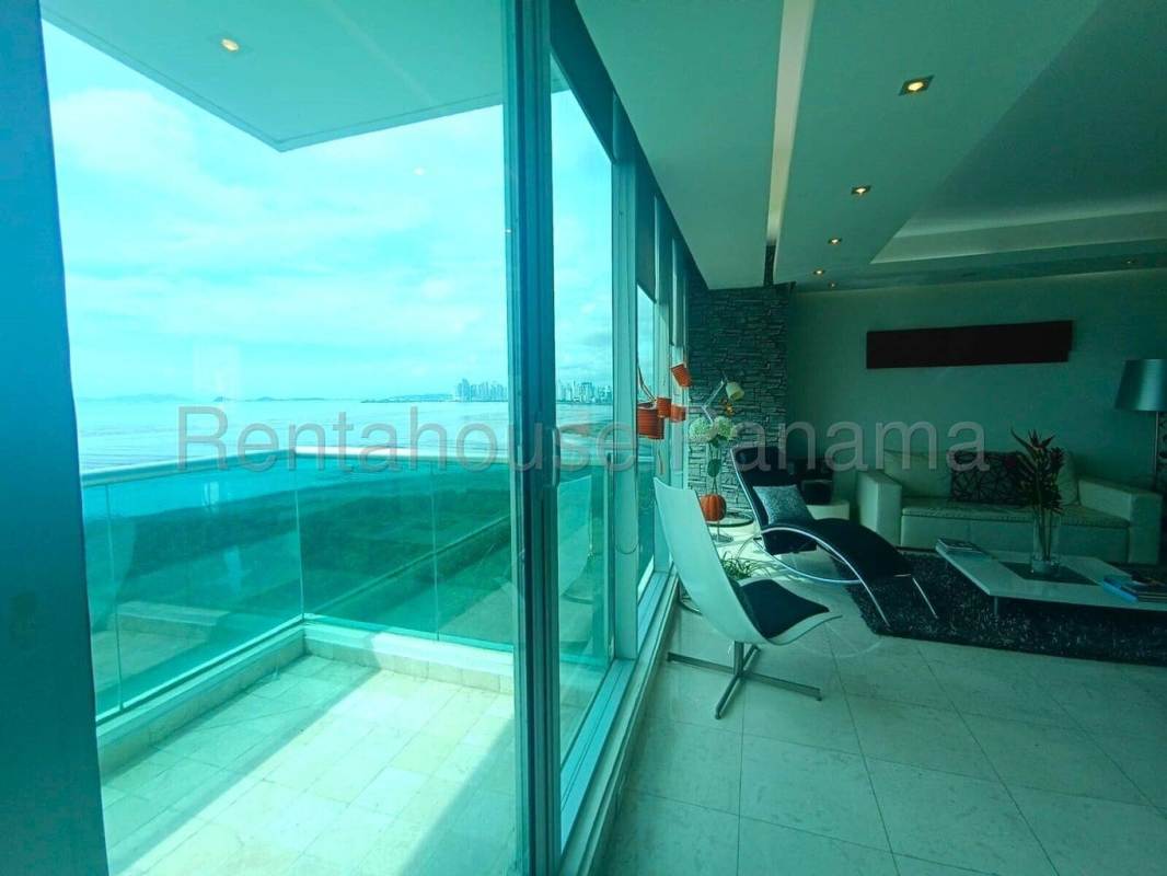 Kitchen with granite countertops and wood cabinetry in PH Ocean Two apartment Panama