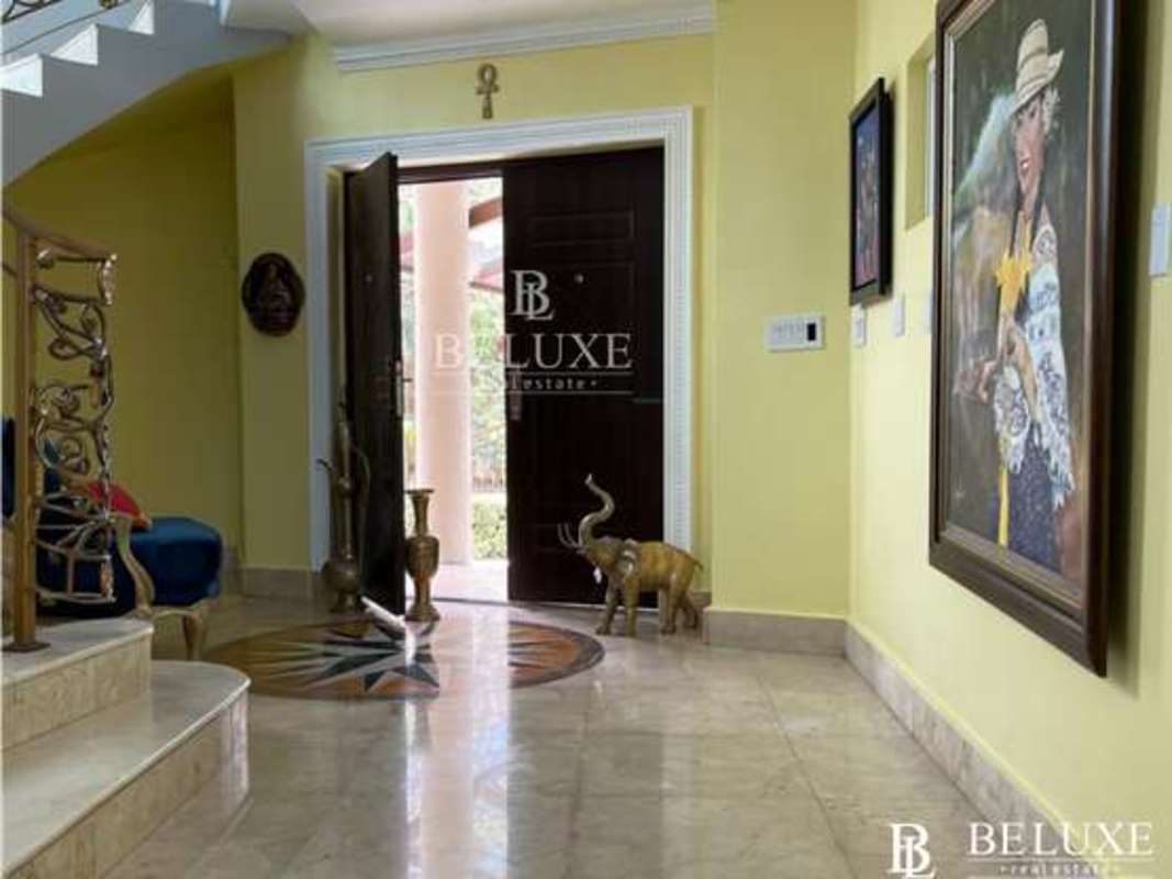 Spacious living room with elegant furniture, tile floors in Los Ríos Panama house