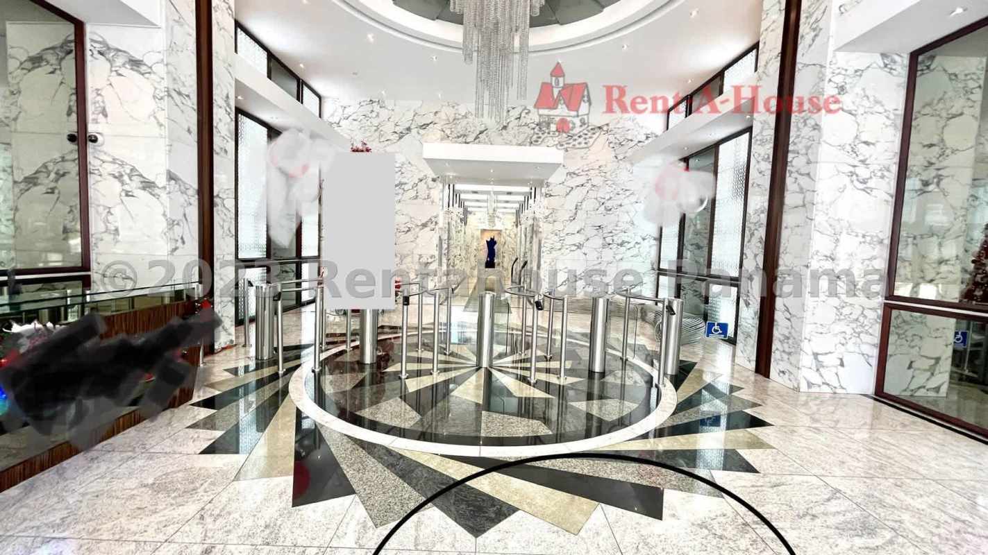 Luxurious commercial building lobby with marble floors and modern design at PH F&F Tower El Tornillo in Panama