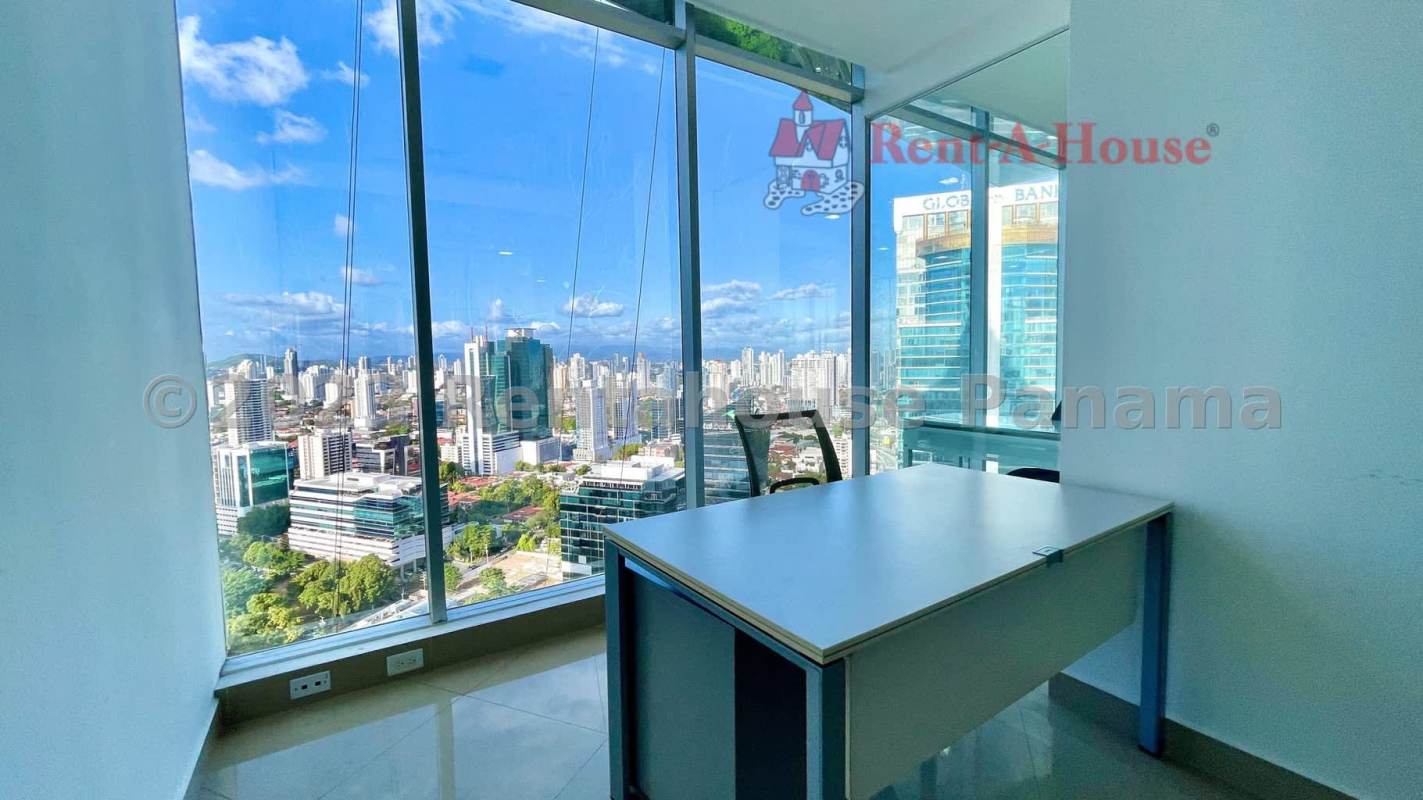 Open office space with floor-to-ceiling windows and panoramic city views in PH F&F Tower Panama City