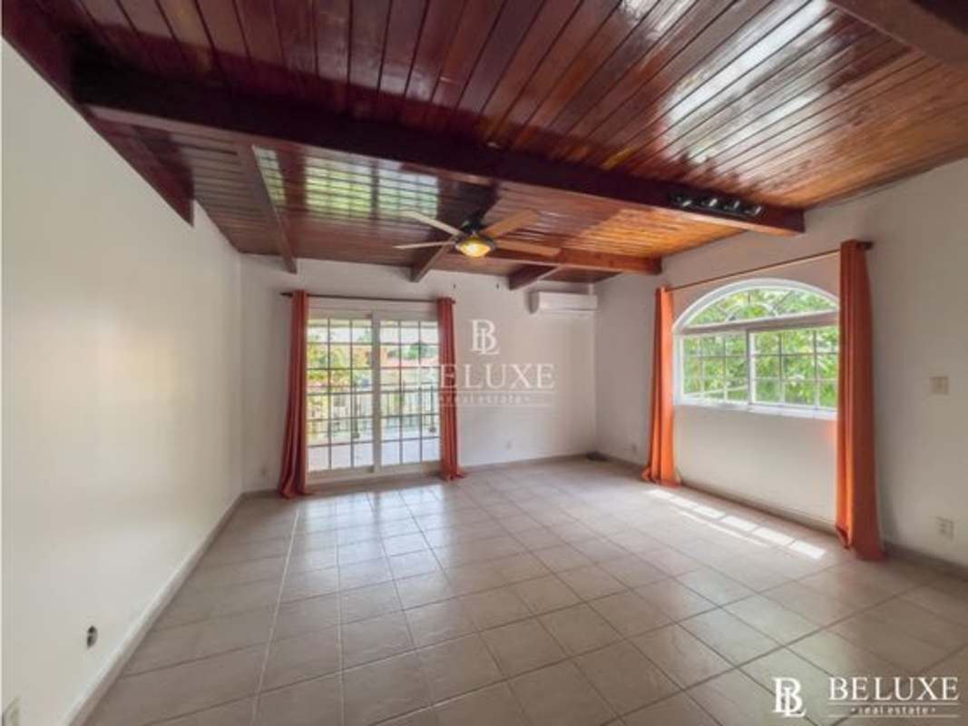 Spacious master bedroom with balcony access in Cardenas Village house rental Clayton Panama