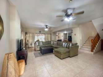 Mediterranean styled villa with tiled roof and gardens in Playa Blanca Resort Panama