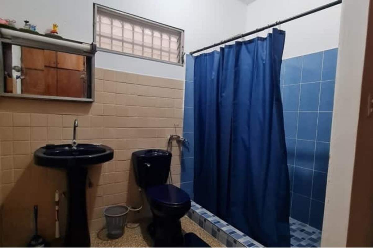 Covered outdoor patio with chairs Betania Panama house for sale