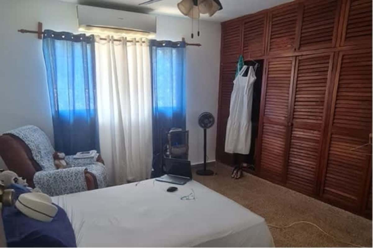 Traditional kitchen with wood cabinetry, granite countertops and island Betania Panama