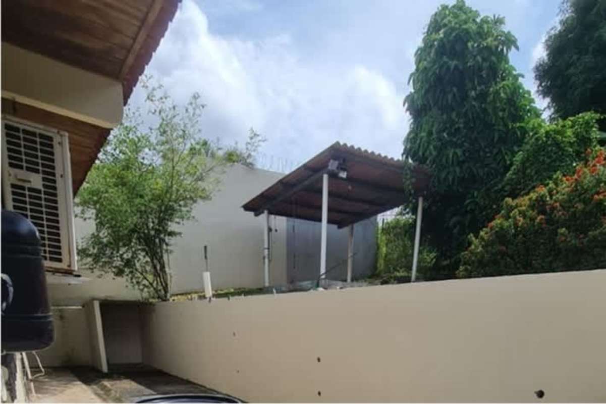 Exterior backyard covered patio ranchito Betania Panama house BBQ area