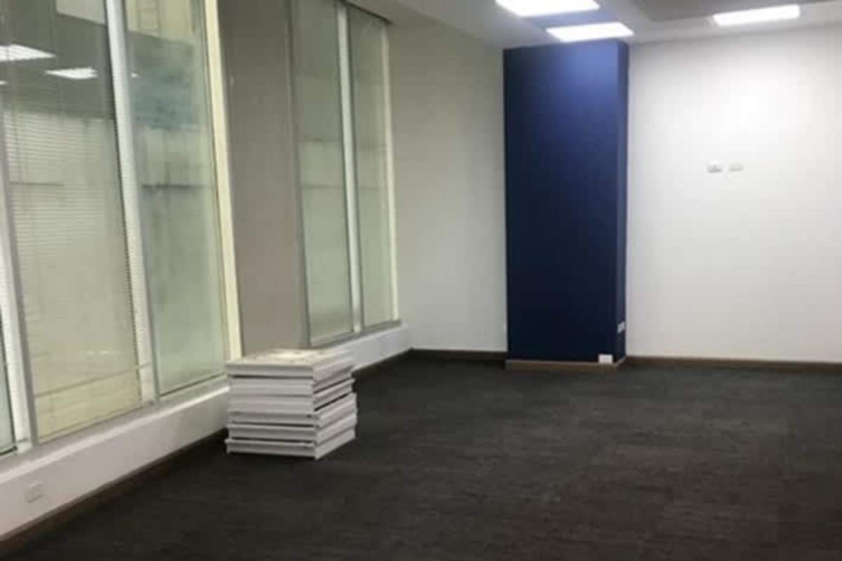 Professional office hallway with glass partitions at Marbella Business Center Panama City