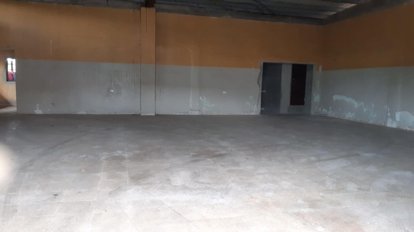Wide interior of empty industrial warehouse space with concrete floors in Pacora Panama