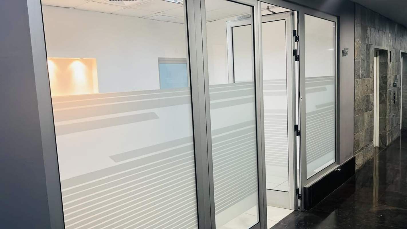 Empty modern office with glass enclosure tiled floors PH Office One Obarrio Panama