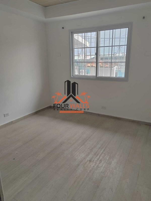 Private office room with window bars, laminate flooring, drop ceiling in commercial property El Dorado Panama