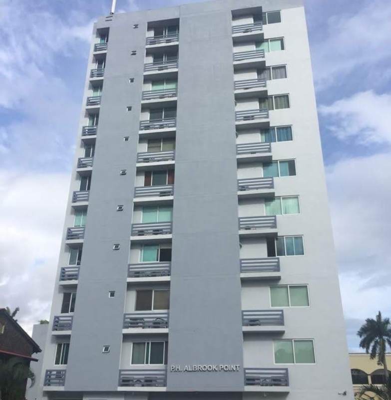 Mid-rise condominium PH Albrook Point with balconies tropical landscaping in Clayton Panama City