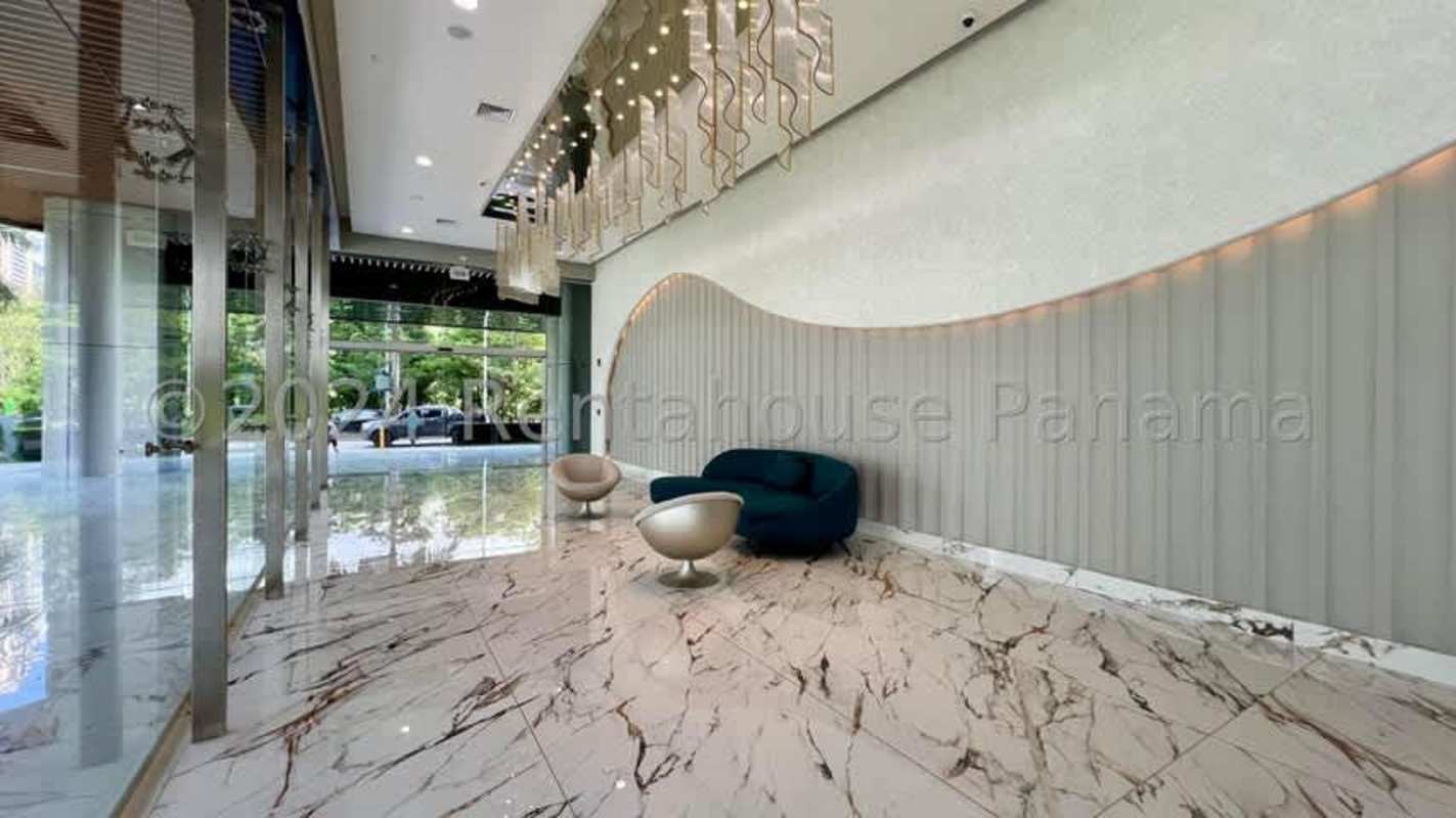 Modern luxury lobby with marble floors, decorative lighting and lounge in PH Paramount Costa del Este Panama