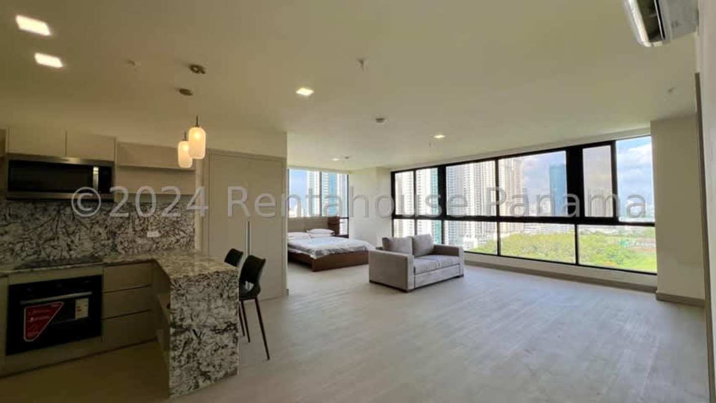 Modern elevator lobby with marble floors and frosted glass doors in PH Paramount Tower Panama