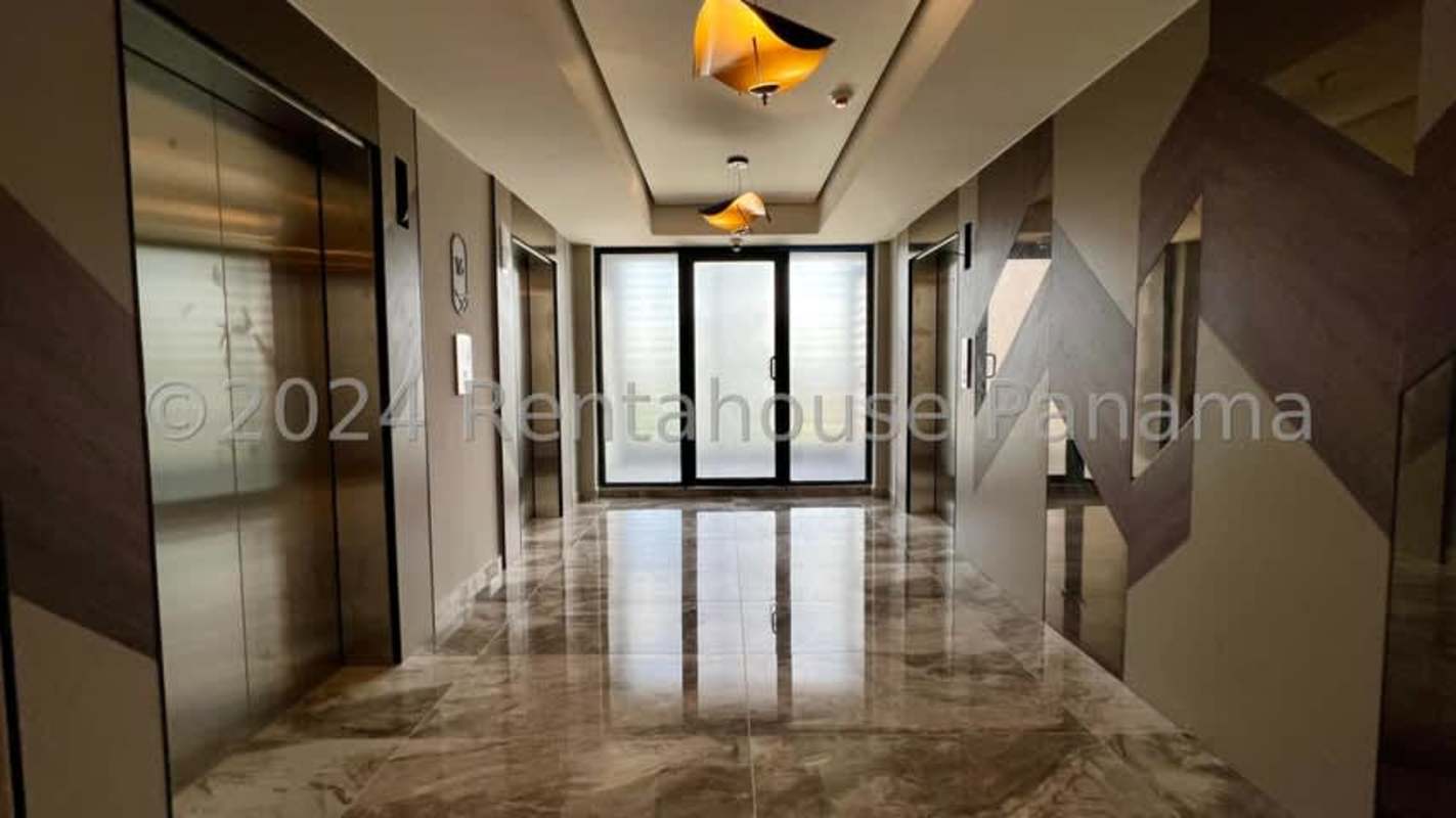 Contemporary marble lobby and reception with decorative lighting in PH Paramount Costa del Este Panama