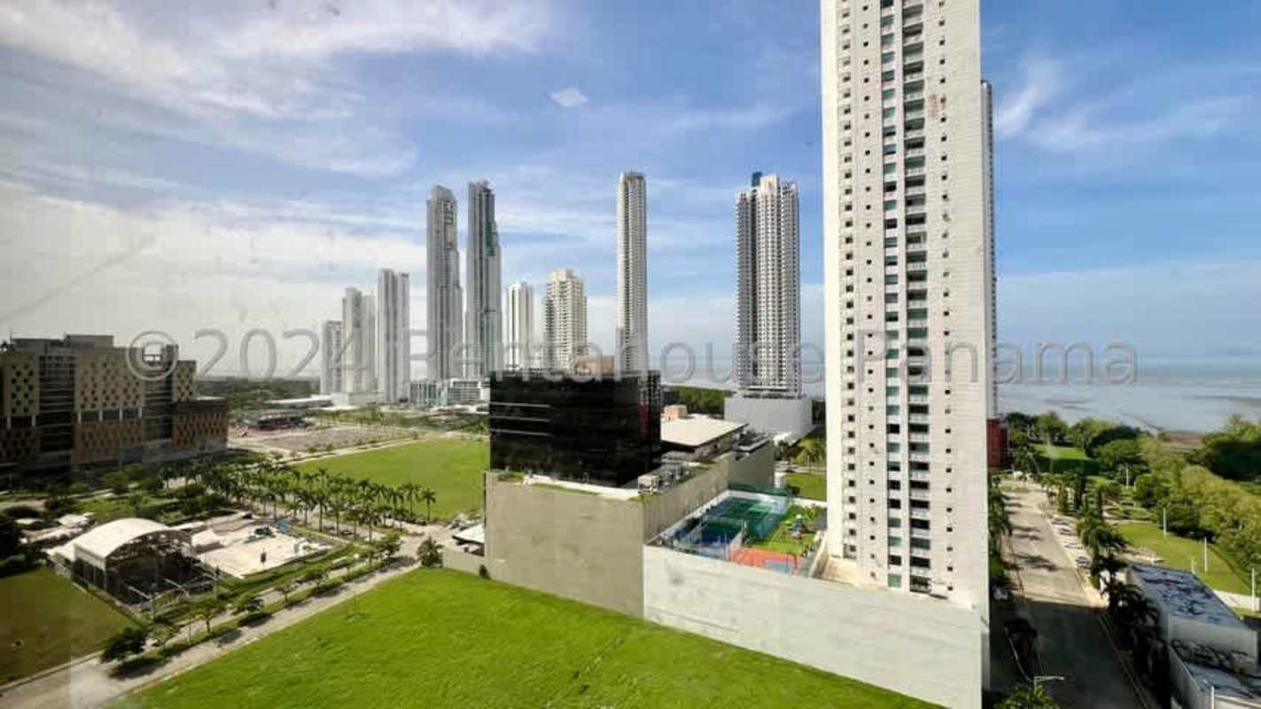 Modern open-concept apartment with panoramic windows and marble kitchen countertop PH Paramount Costa del Este Panama