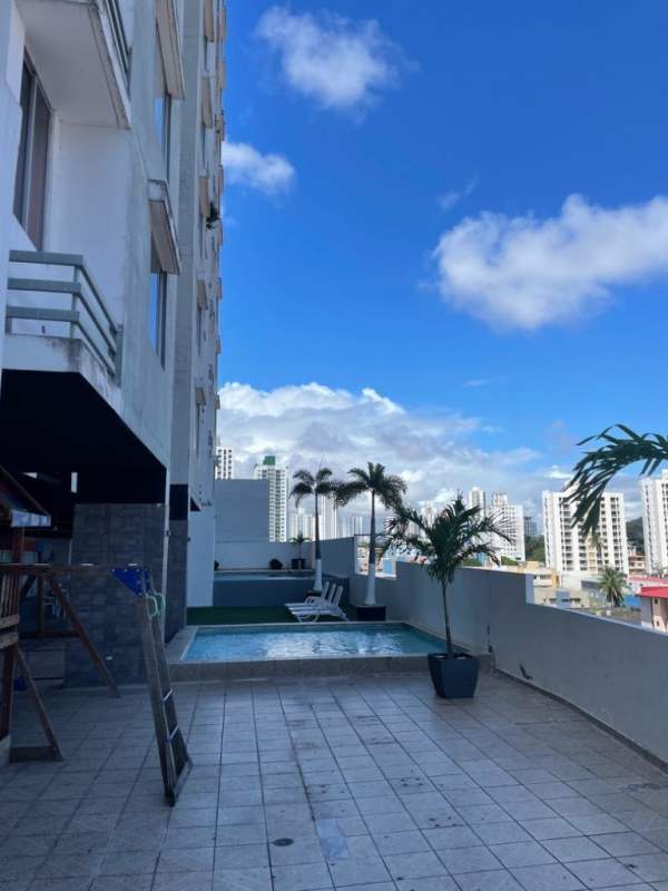 High-rise residential tower PH Plaza Valencia with balconies and city sky Carrasquilla Panama