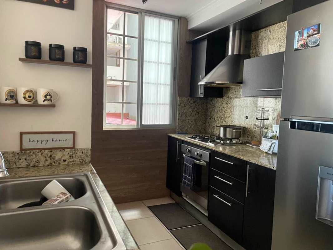 Kitchen equipped with granite countertops, stainless steel appliances in PH Plaza Valencia Carrasquilla Panama
