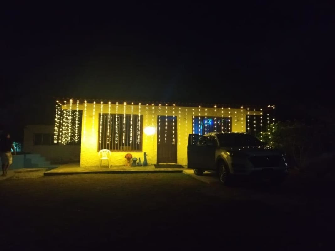 Large rustic living room with ceiling beams sofa and holiday decor country home Pacora Panama