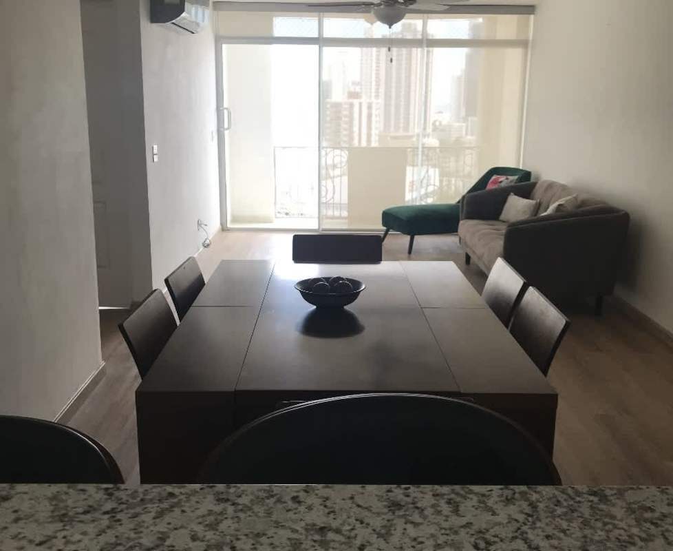 Modern living dining area with glass doors to balcony in PH Cangrejo Central Panama City