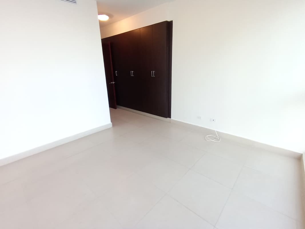 Spacious living area with large windows and ocean views PH Oceanaire Punta Pacifica Panama