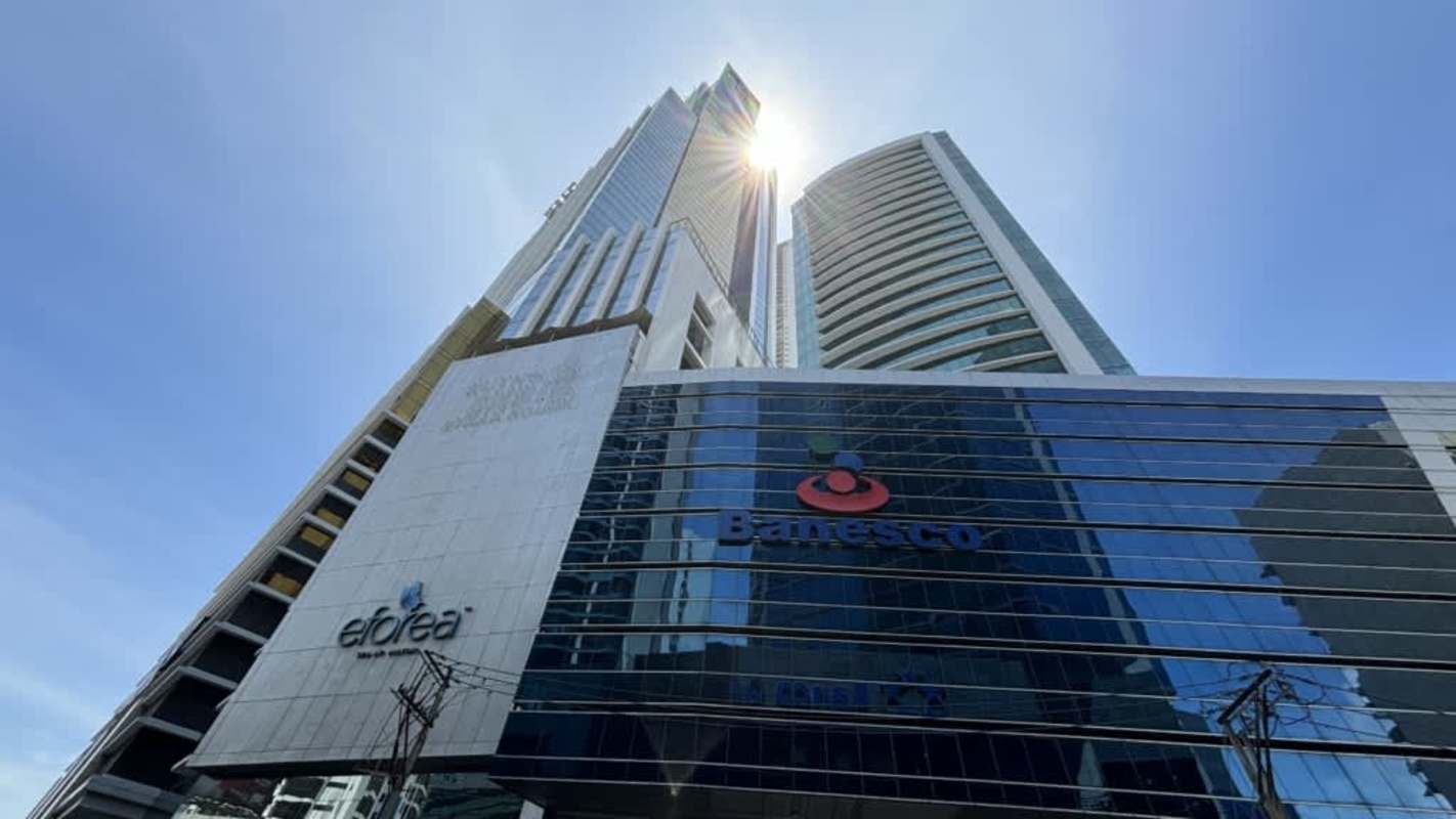 Private office with glass walls and built-in wooden cabinets in Ocean Business Plaza Panama City