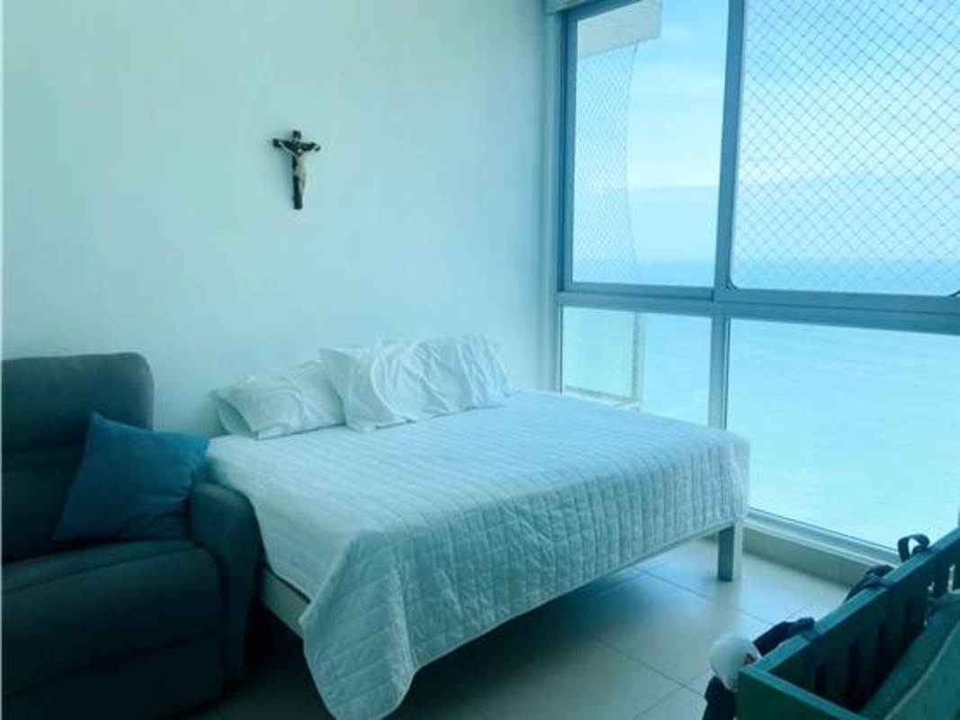 Private balcony with glass railing offering Pacific Ocean panorama from luxury apartment in PH Dupont Panama City