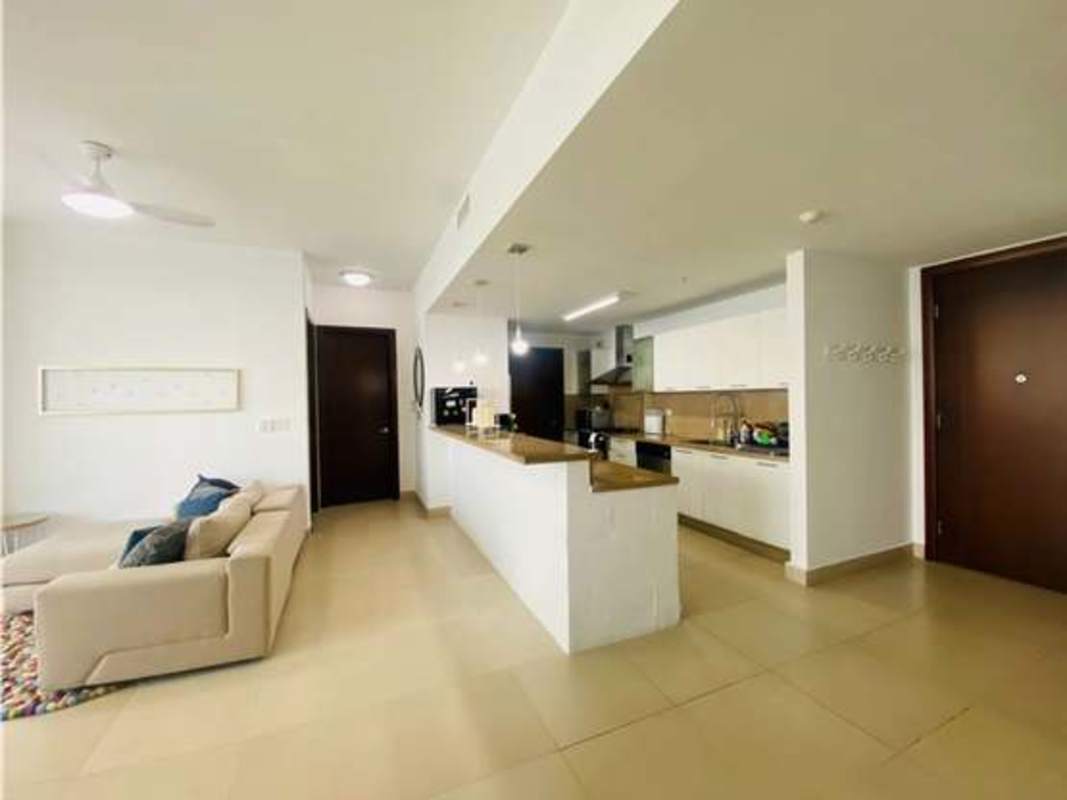 Spacious master bedroom with large window overlooking Pacific Ocean and private bathroom in PH Dupont Panama City