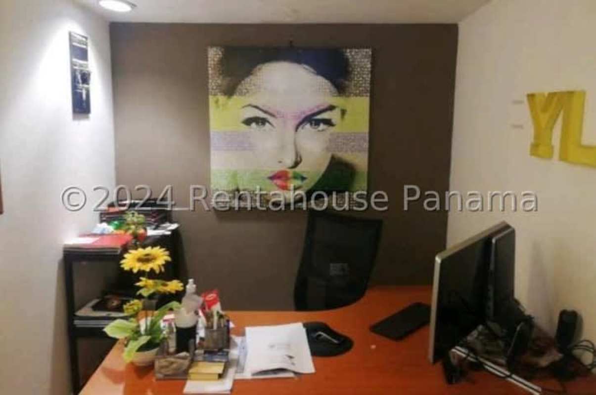 View of commercial property entrance with parking and fencing near Ave Domingo Díaz