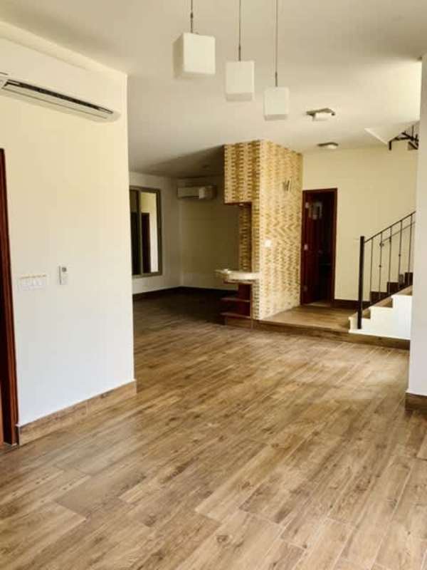 Bright dining and family living area with garden views in Embassy Garden house