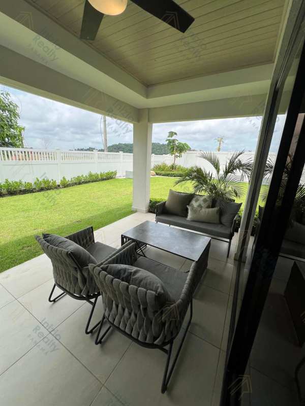 Spacious living room with abstract wall art in new family home Brisas del Golf Panama City