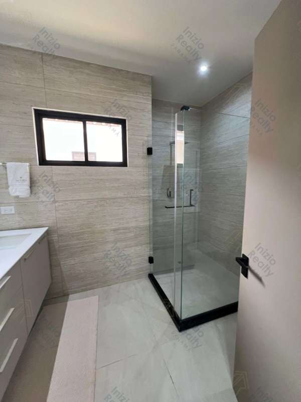 Bathroom interior with glass walk-in shower and sleek design Brisas del Golf house