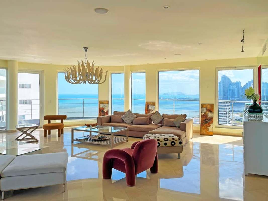 Spacious kitchen with granite countertops red accent wall stainless appliances penthouse PH Belvedere Park Coco del Mar