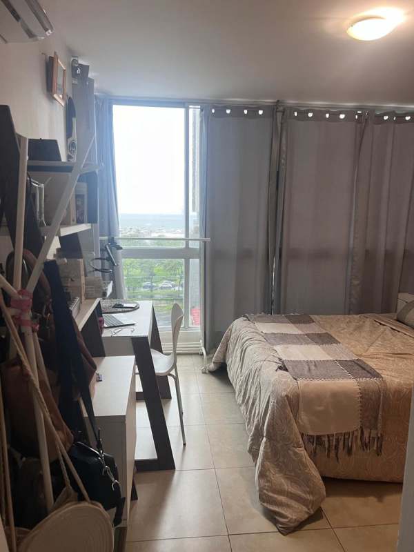 Master bedroom with ocean view window in PH South Beach Panama City