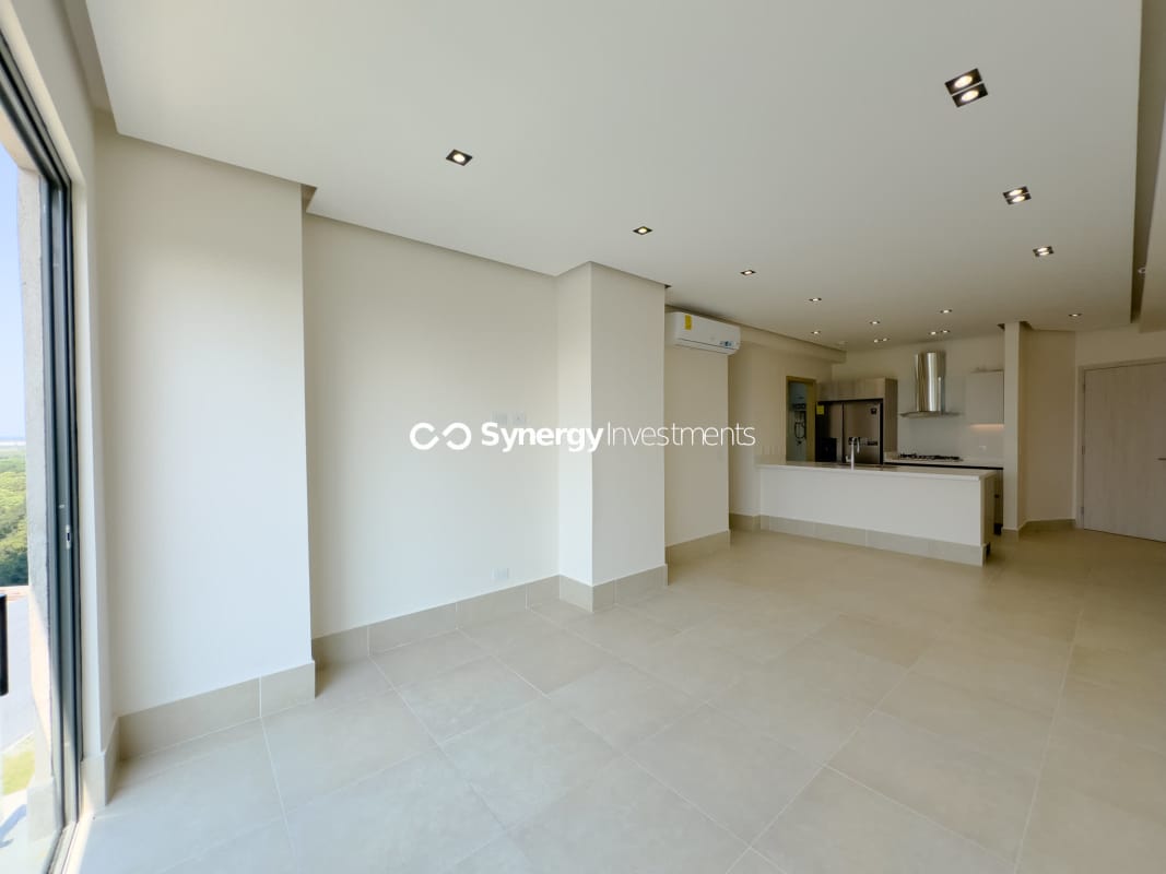 Infinity pool, sun deck and spa amenities with city skyline and golf greens views at Santa María Panama