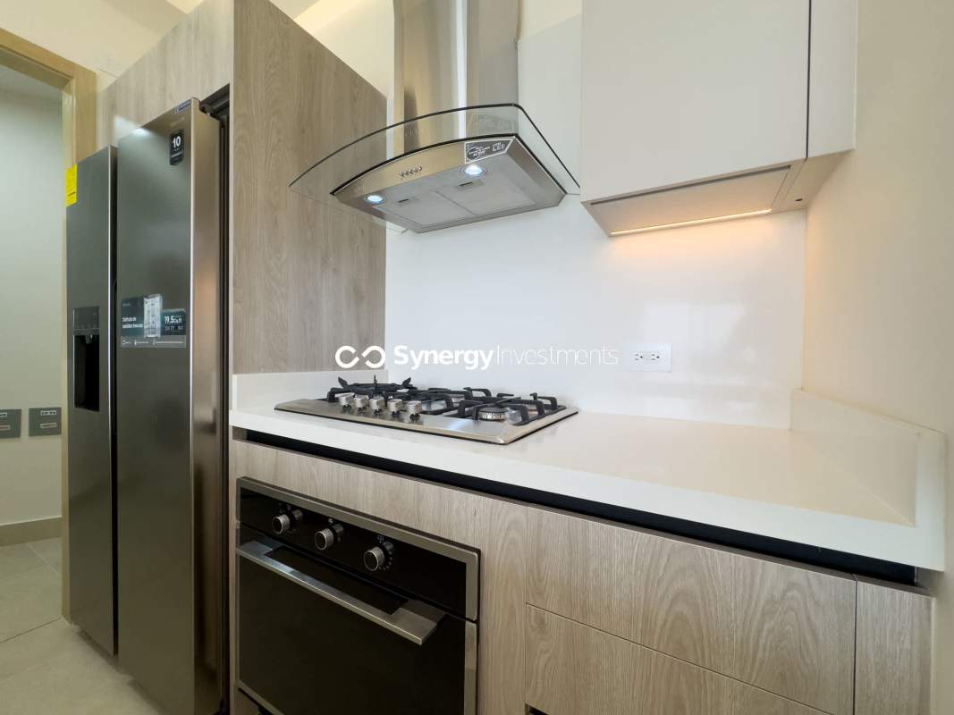 Contemporary kitchen with quartz countertops, appliances and island in PH Maryland Santa Maria Panama City