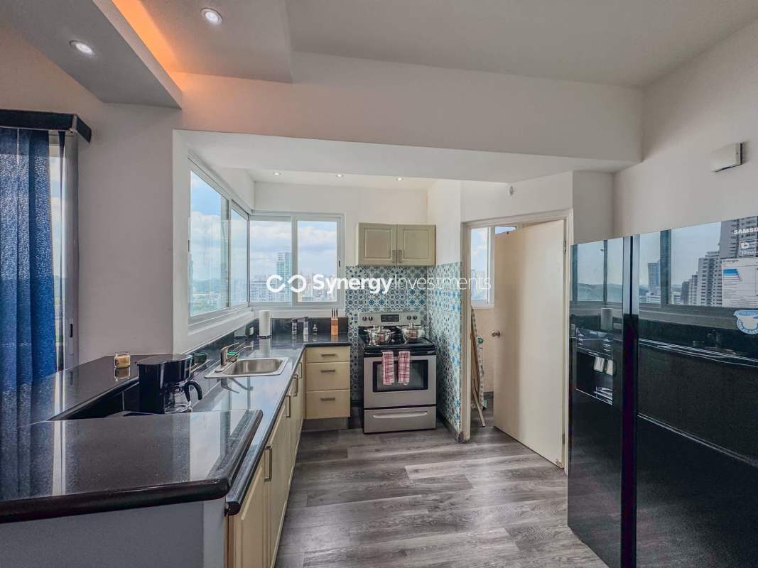 Contemporary kitchen with granite countertops, mosaic backsplash PH Yacht Club Avenida Balboa