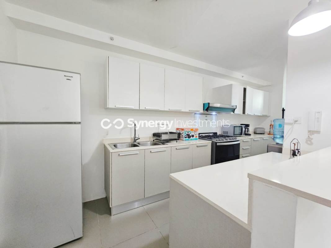 Luxury apartment lobby with marble accents, modern furniture, elevators in PH Bellavista Tower Panama