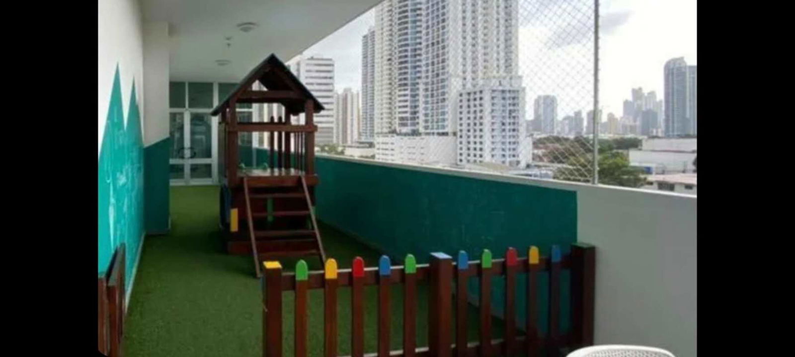Apartment balcony with fenced kids’ play area and skyline view in PH South Coast Panama