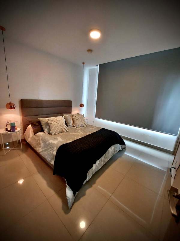 Primary bedroom with AC, pendant lights, and large closet PH South Coast Panama