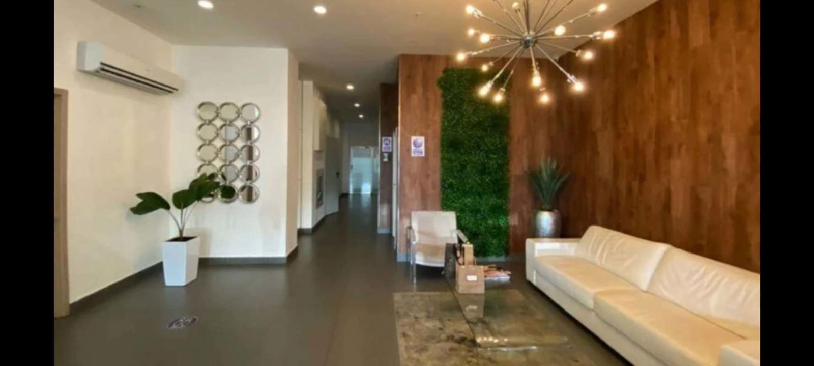 Modern gym with weights, mirrors, and AC PH South Coast San Francisco Panama